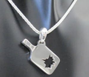 Chaine with a pickleball paddle pendant with a blow out inside the pendant.
