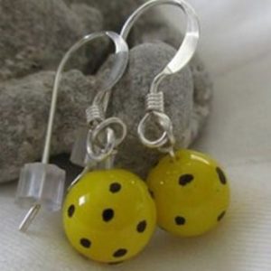 Pickleball earrings with a pickleball ball.
