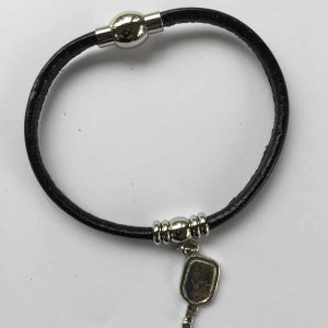 Image of a leather pickleball bracelet with a pickleball paddle pendant.