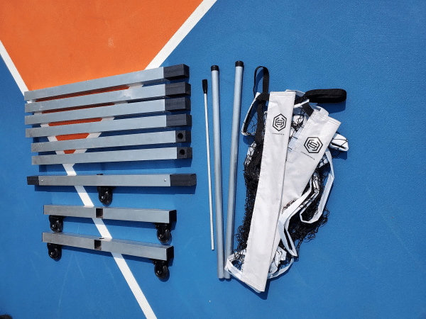 Image of a rolling portable pickleball net by Dominator.
