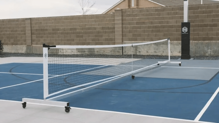 Image of a rolling portable pickleball net by Dominator.